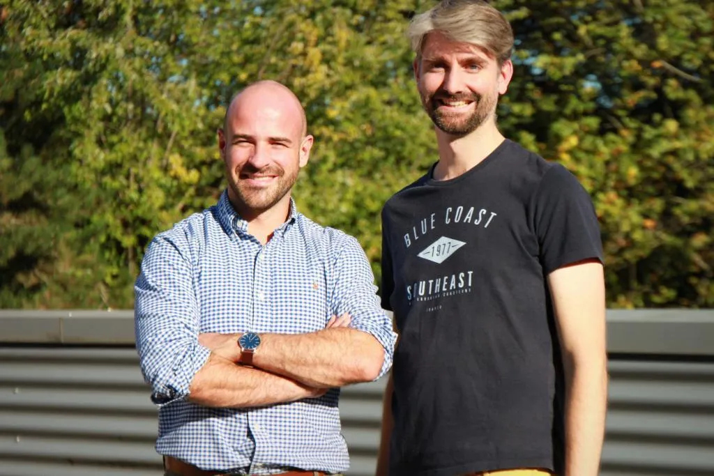 Two Picterra co-founders standing outdoors smiling, representing leadership and vision for the company.