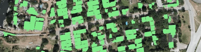Aerial image of urban settlement with building footprints detected using AI