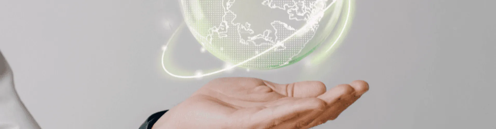 Hand holding a glowing digital hologram of Earth