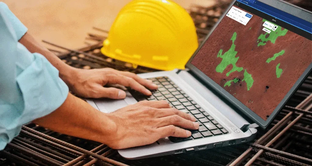Photograph of Picterra being used on a laptop in a mining environment