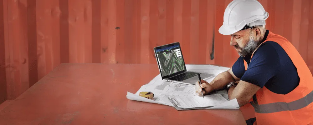 Photograph of Picterra being used on a laptop in a mining environment