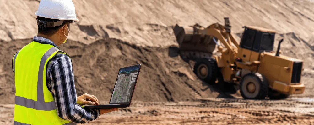 Photograph of Picterra being used on a laptop in a mining environment